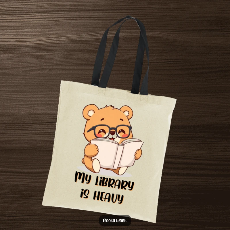 Funny bear character wearing reading glasses, excitedly flipping pages of a book on a durable tote bag.